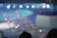 Blurred lights and indistinct shapes create an abstract, dreamy atmosphere, resembling an out-of-focus night scene.