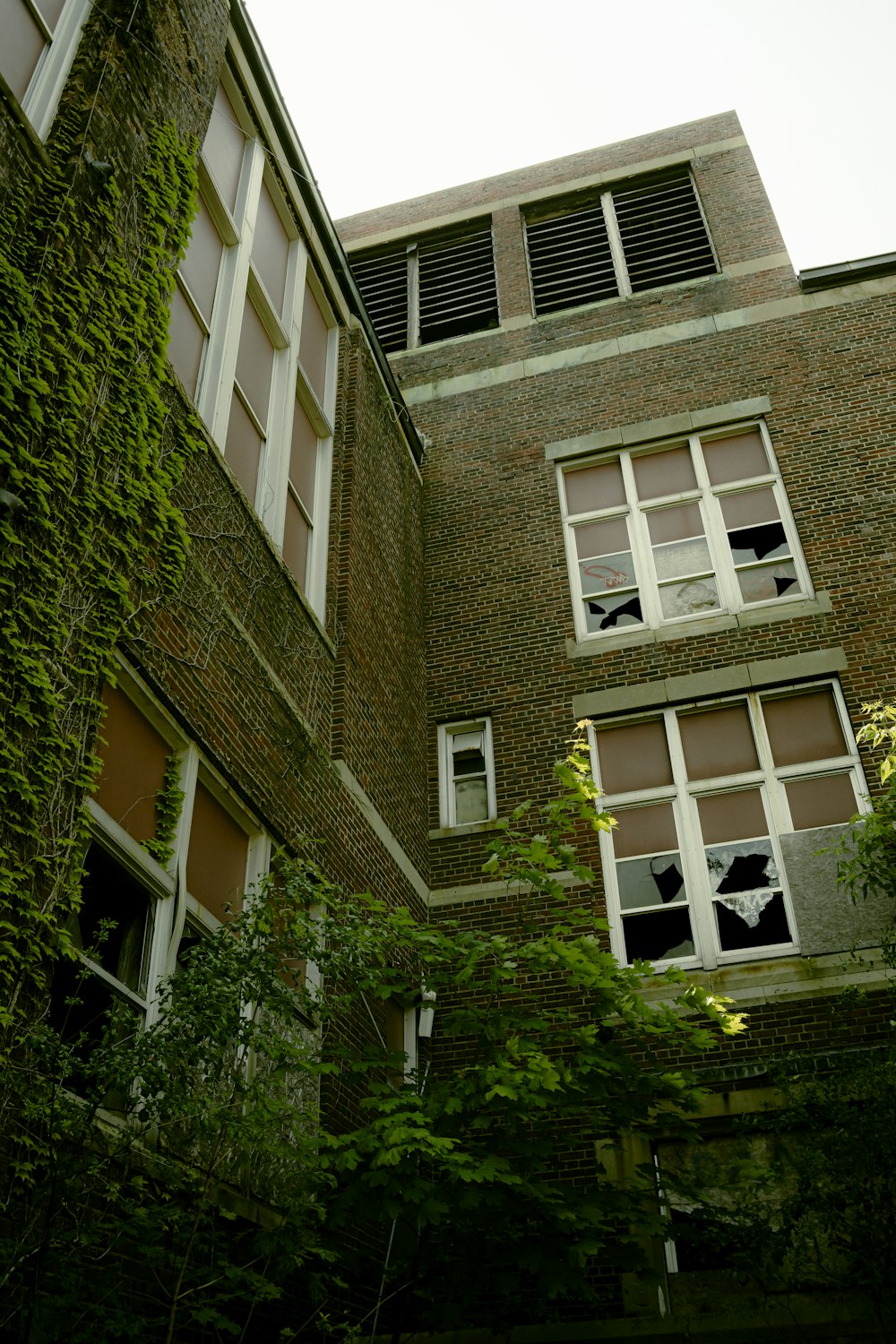 a tall brick building with lots of windows