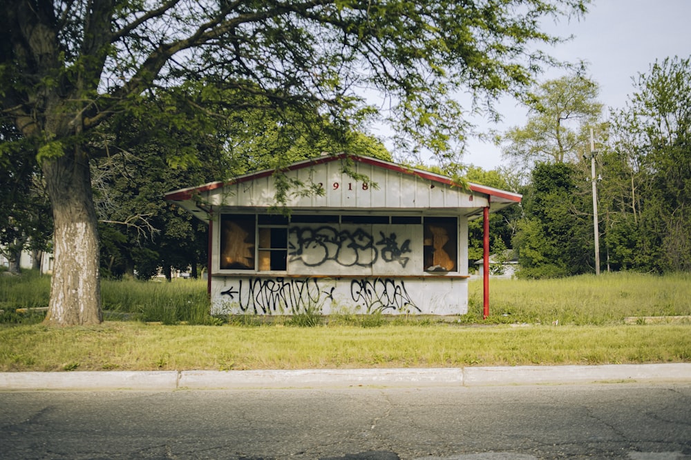 a run down building with graffiti on the side of it