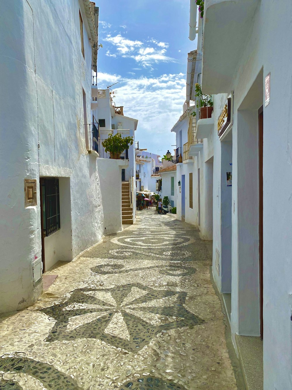 a cobblestone street in a small town