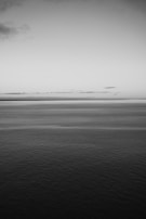 A tranquil seascape in monochrome, representing the unconscious.