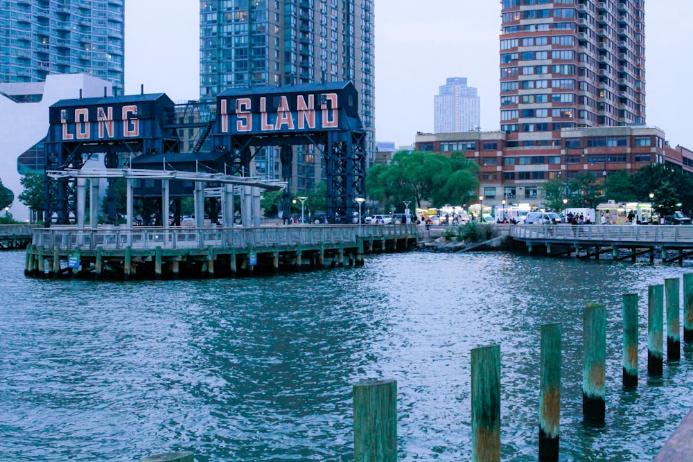 a body of water next to a city with tall buildings