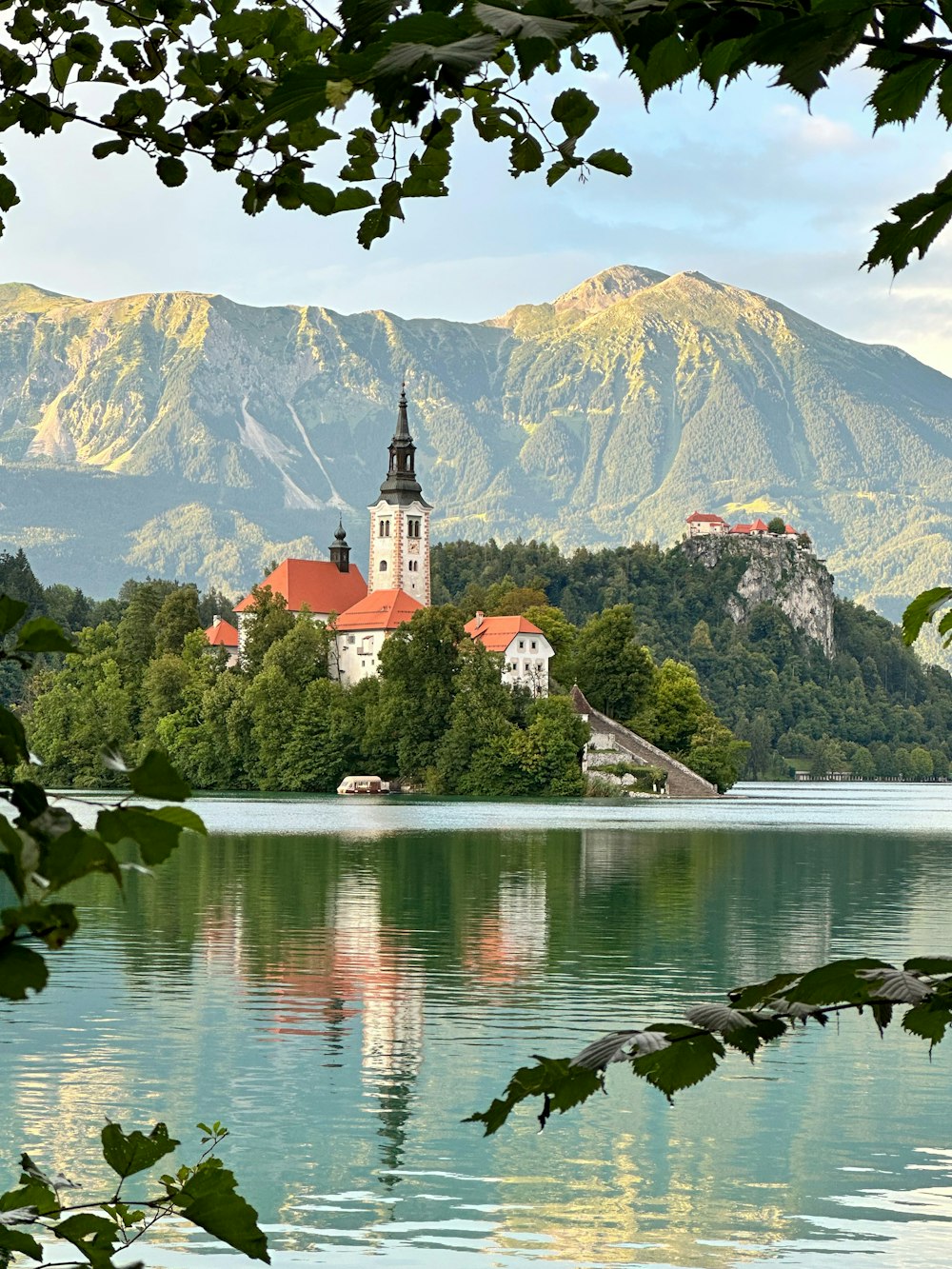 a small island with a church in the middle of a lake