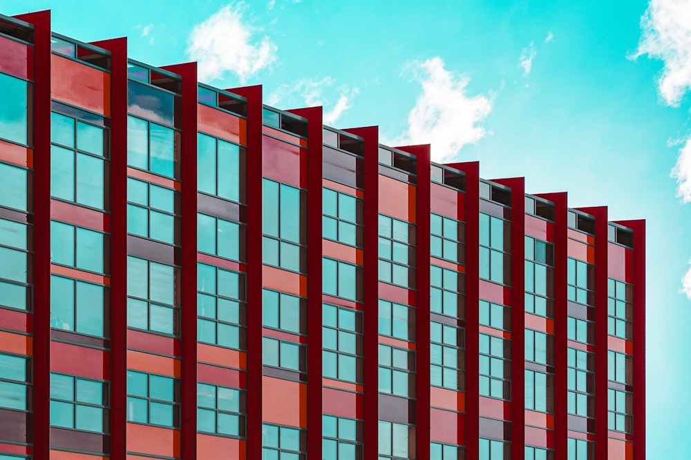 a tall red building with lots of windows