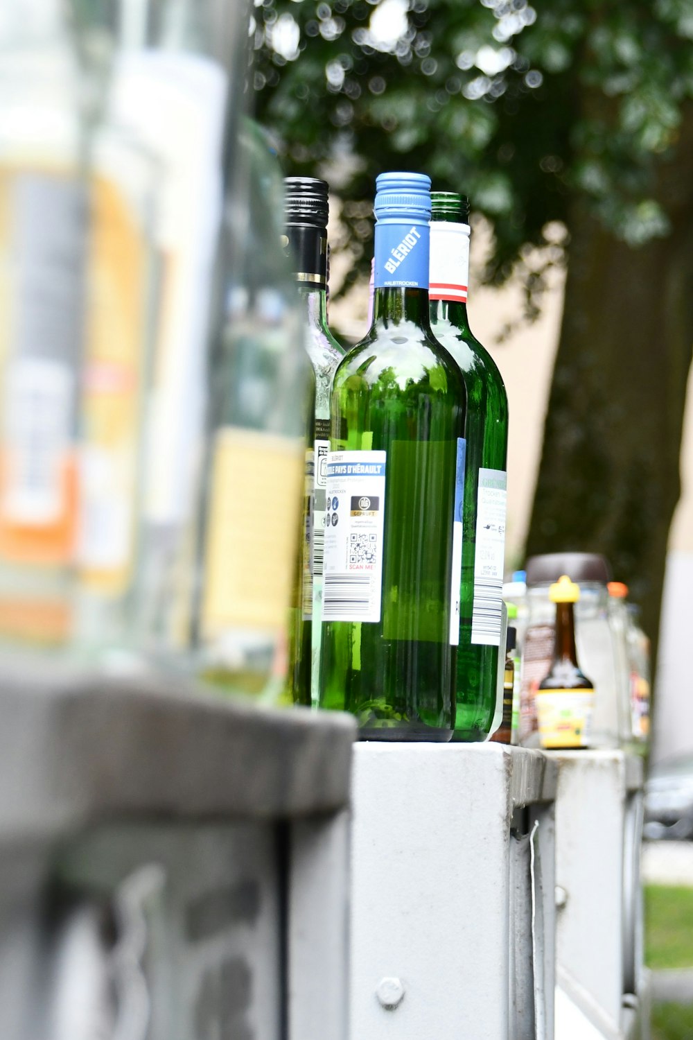 a couple of green bottles sitting next to each other