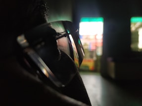Close-up of a person using a computer with clear glasses.