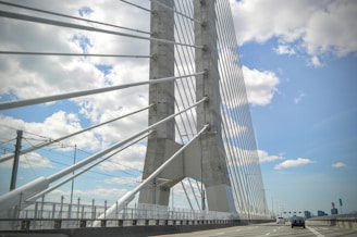 a view of a very tall bridge from a car