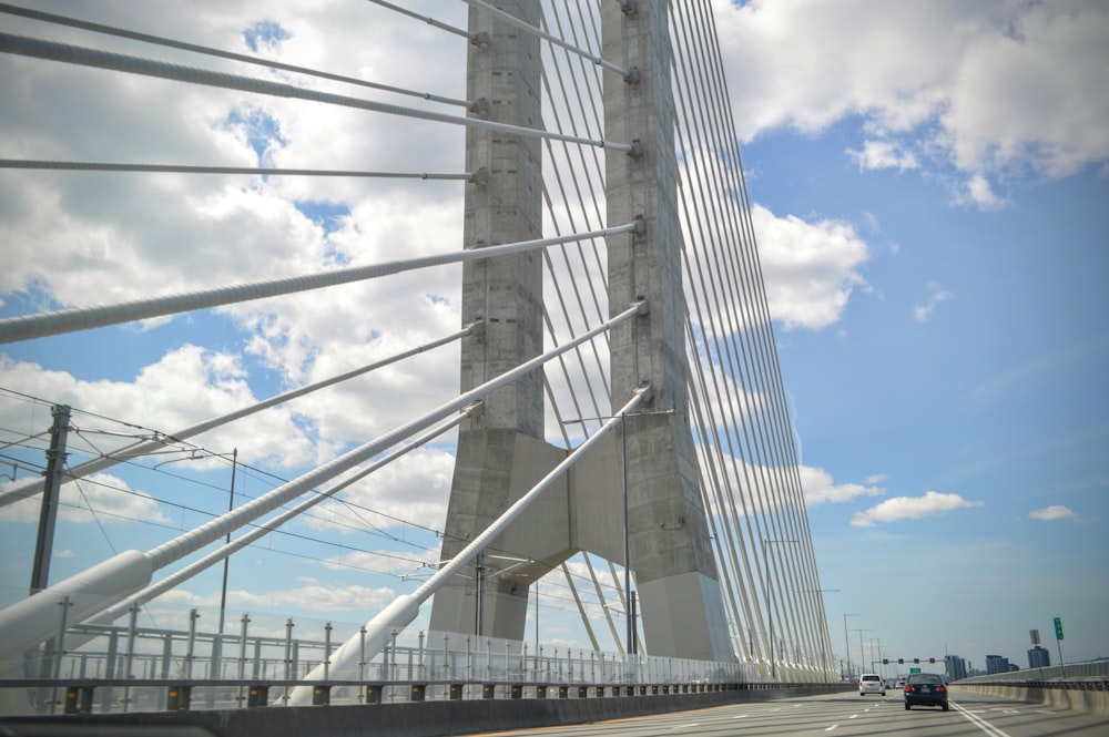 a view of a very tall bridge from a car