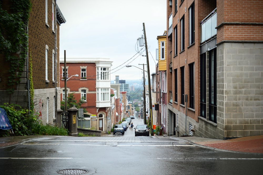 a city street with cars parked on the side of it