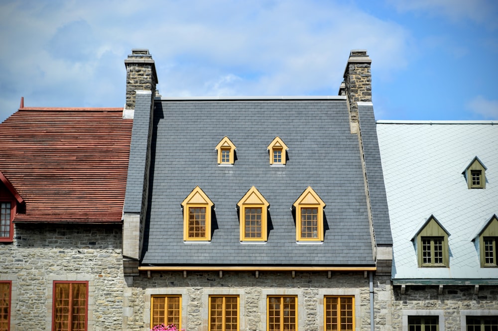 a row of houses with windows on each of them