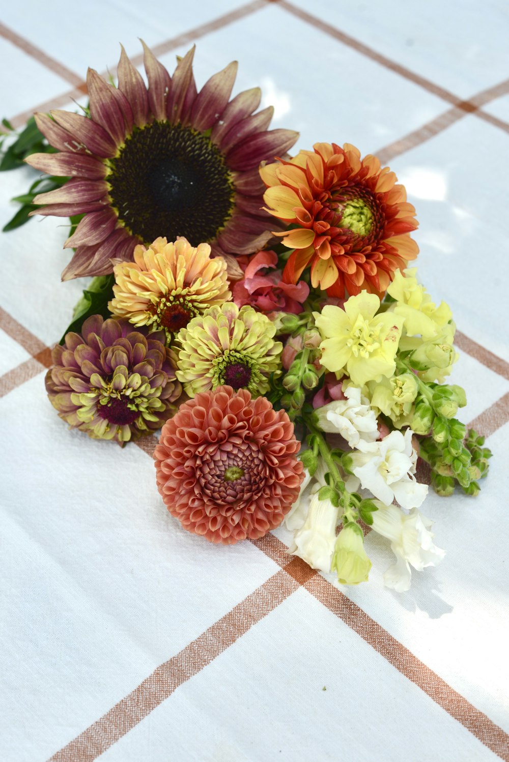 a bunch of flowers sitting on top of a table