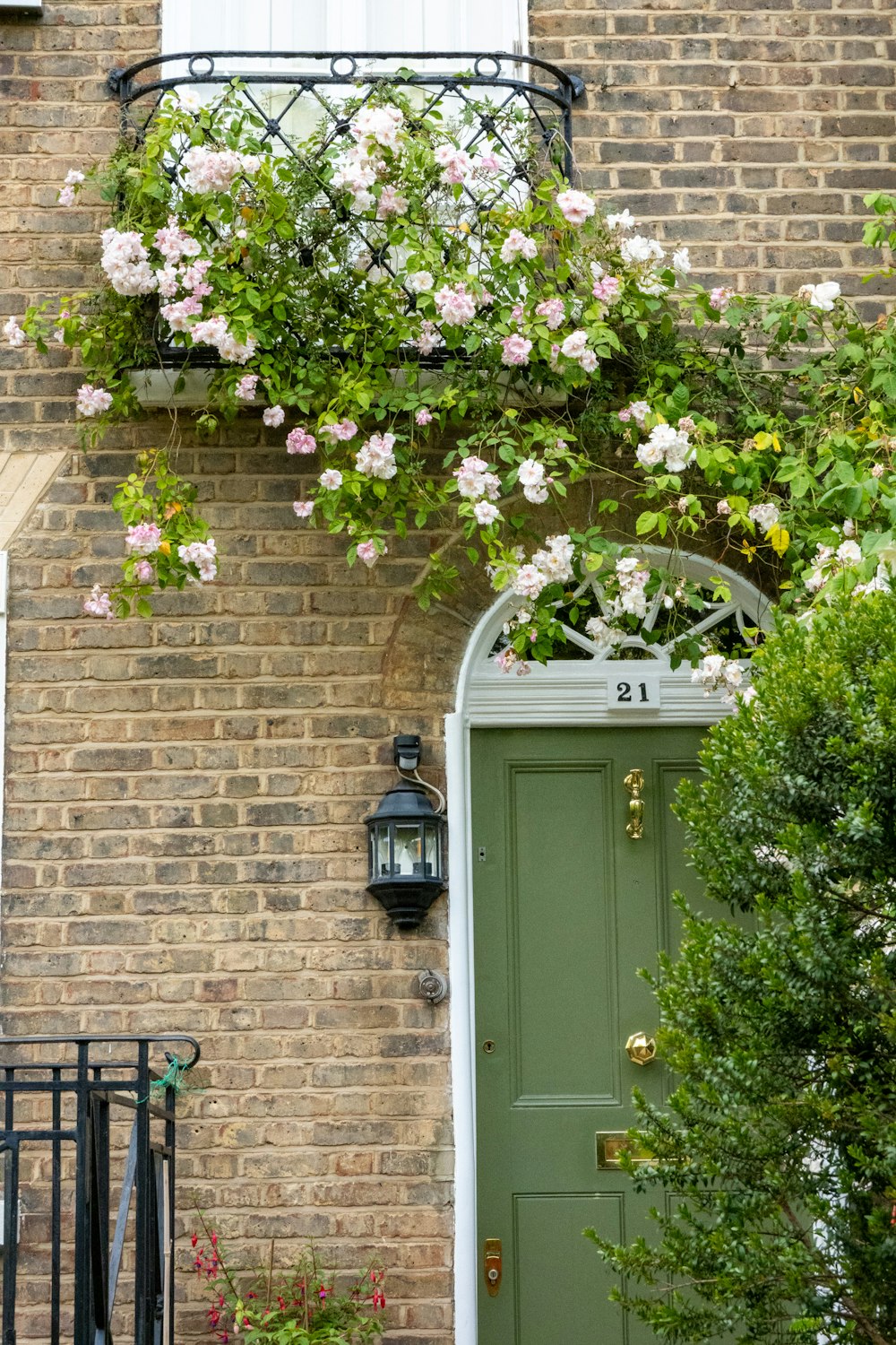 a green front door with a green door and window