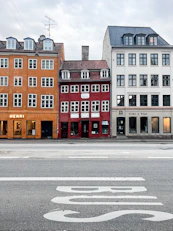 a row of buildings on the corner of a street