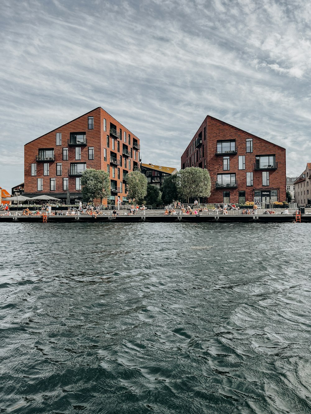 a body of water with buildings in the background