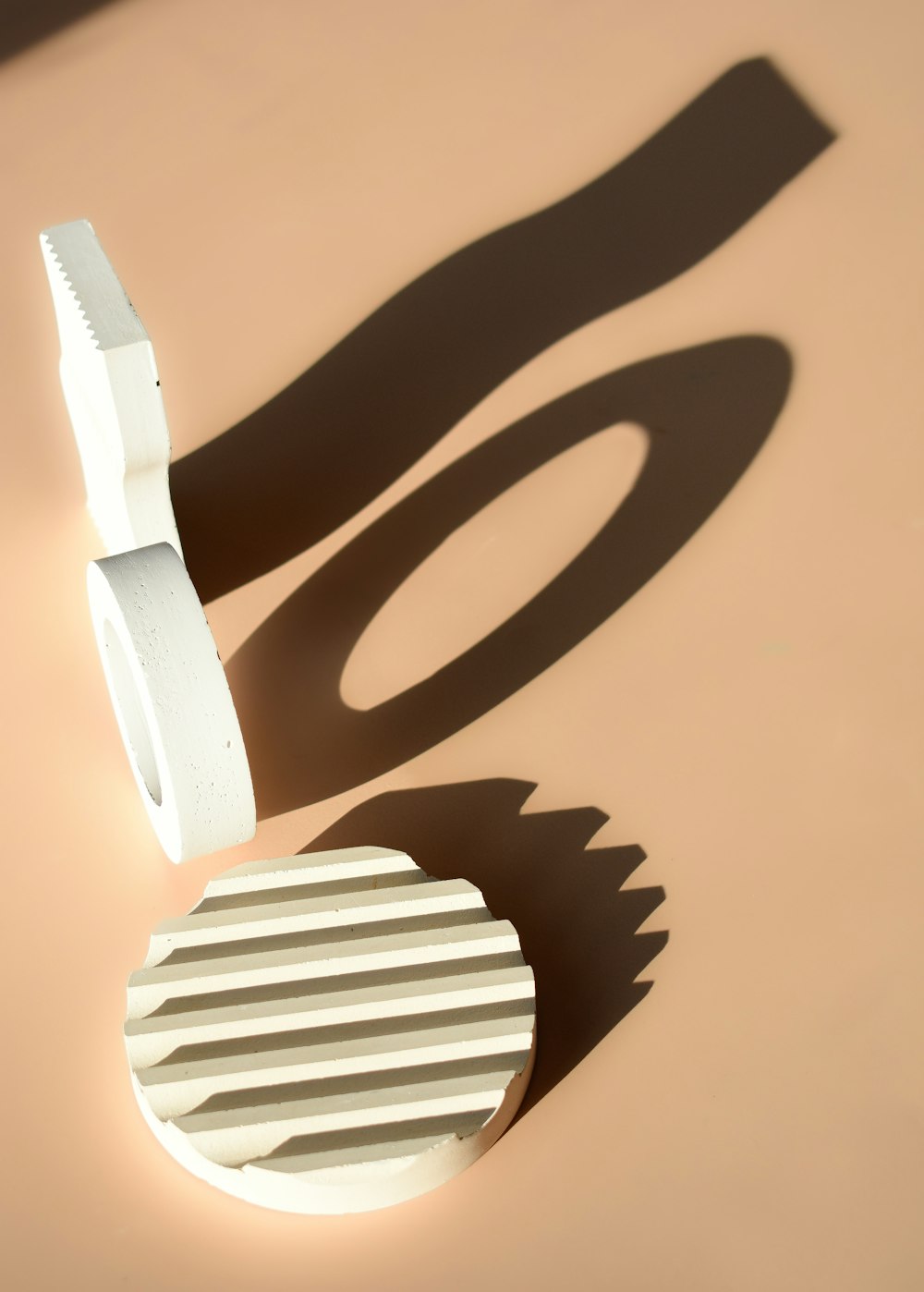 a white object casting a shadow on a wall