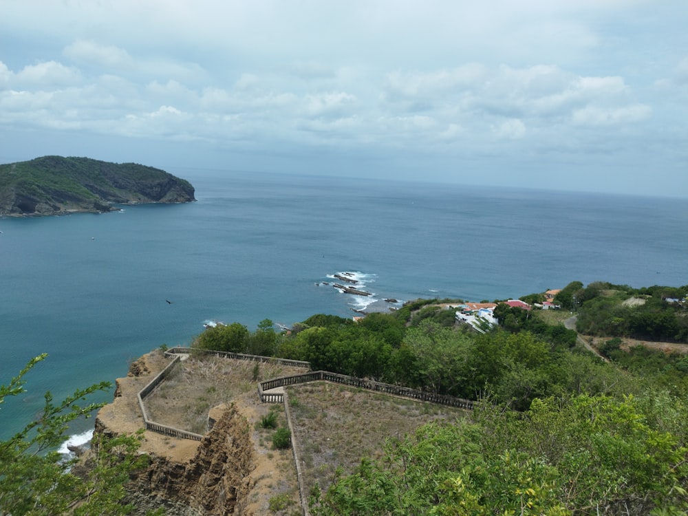 a scenic view of the ocean from a hill