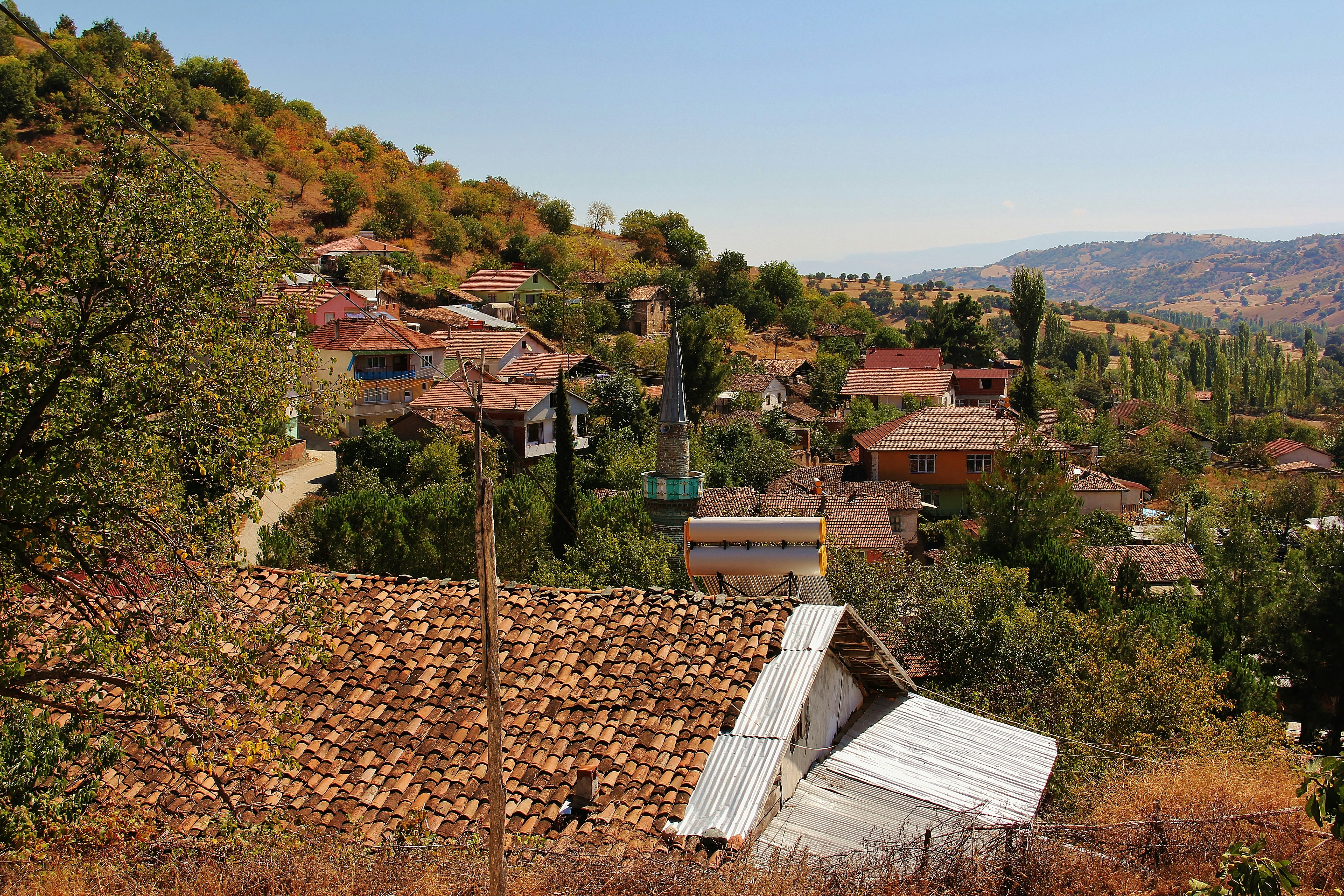 a view of a small village from a hill