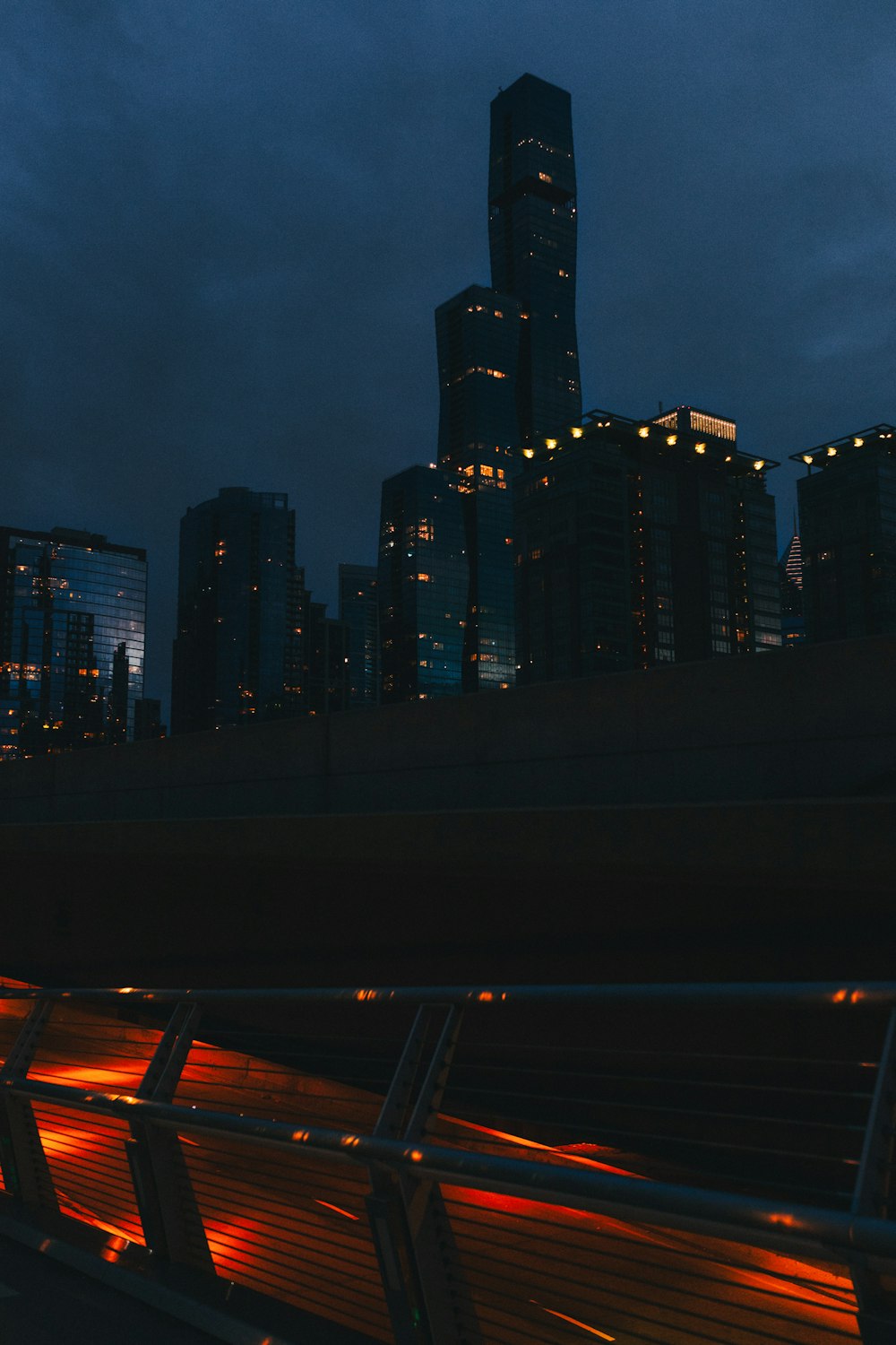 a view of a city at night from a bridge