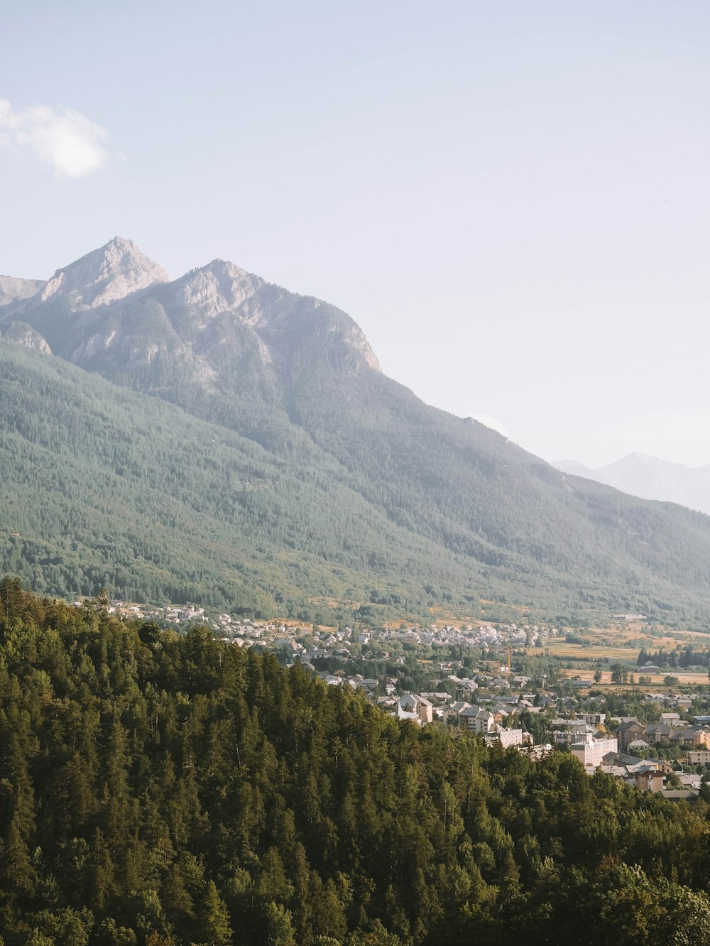 a view of a mountain range with a town in the distance