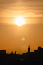 A warm sunset over Buffalo's skyline with the iconic grain elevators glowing softly.