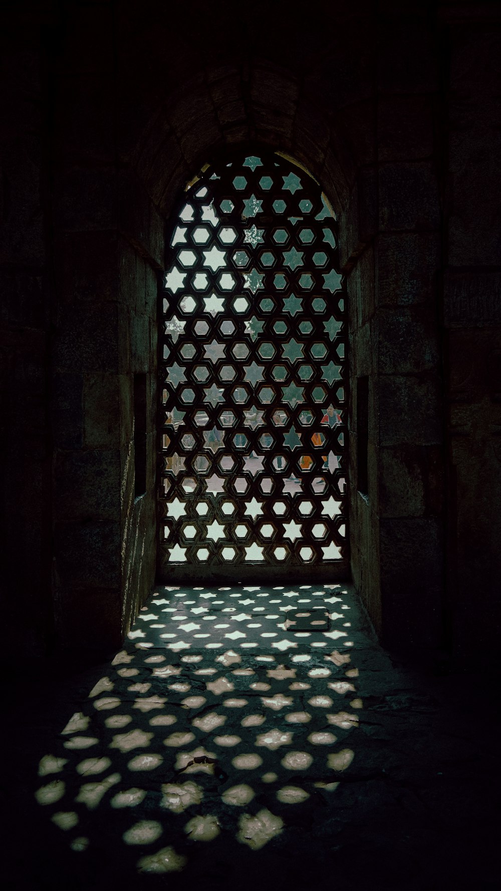 the shadow of a window on a wall