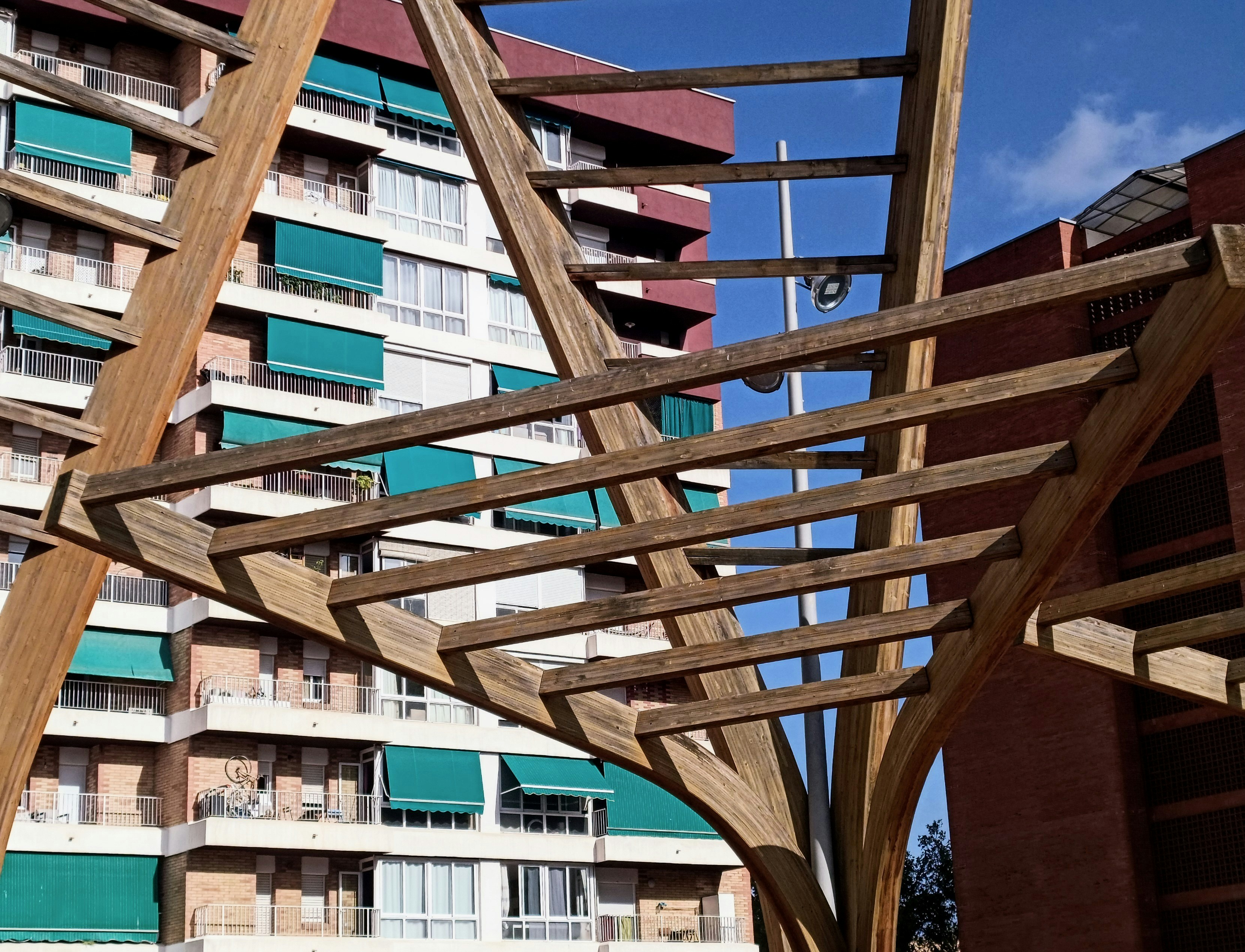 a wooden structure in front of a building