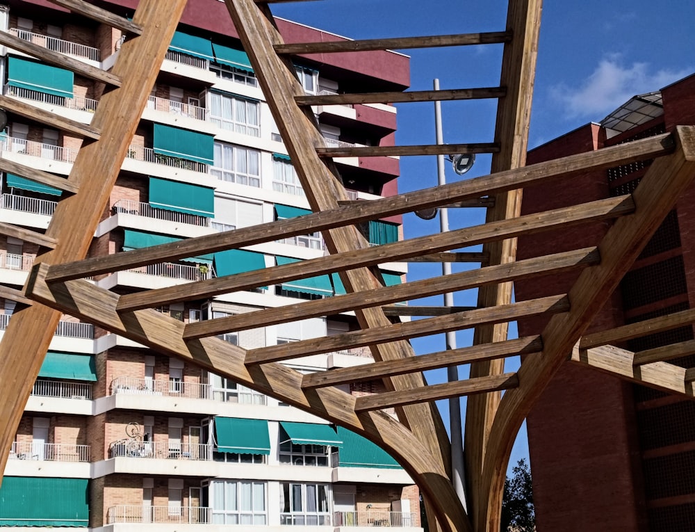 a wooden structure in front of a building