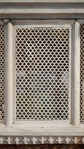 Elegant interior decorative panel with geometric patterns, reflecting the unique style of Aljeser Almaten.