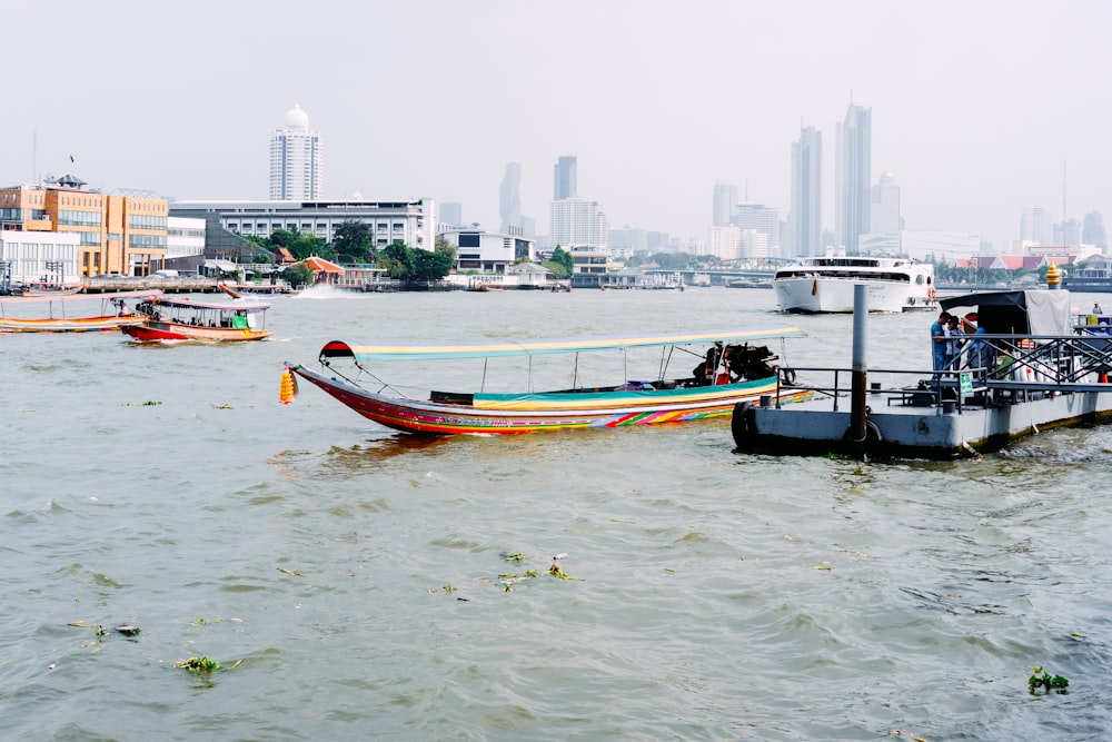 a group of boats floating on top of a body of water