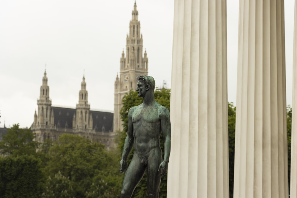 a statue of a man in front of a building