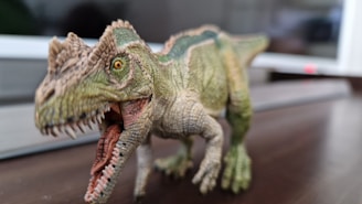 Side view of a Triceratops wooden kit with smooth, polished wood grain visible.