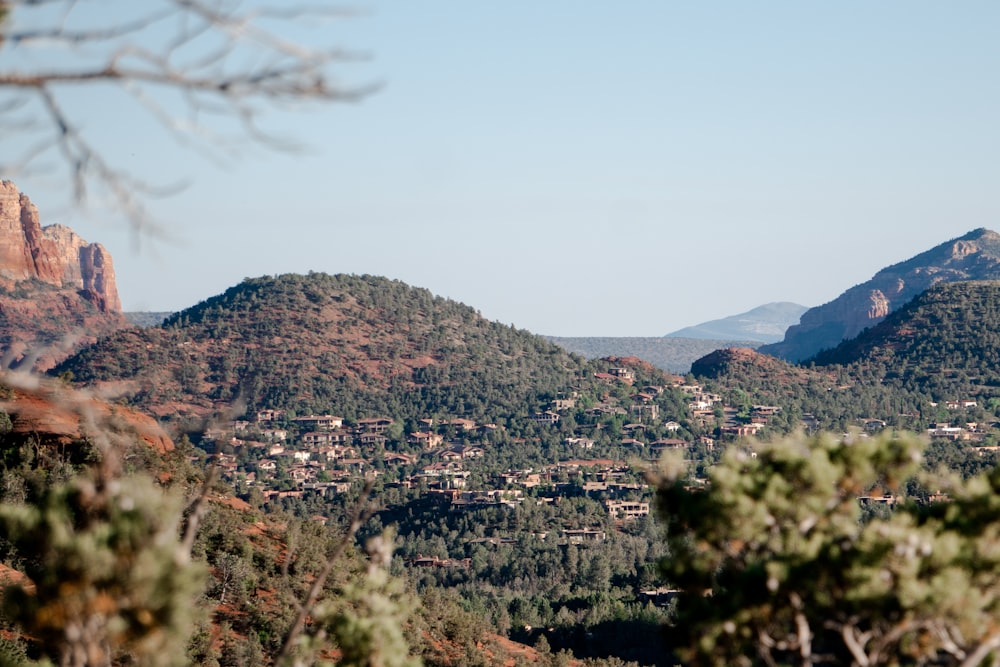 a view of a small town nestled in the mountains