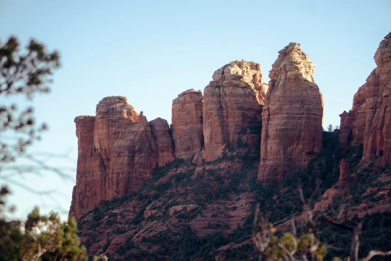 Sedona red rock formations glowing in golden sunset light