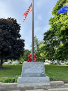 Post members presenting flags during a veterans memorial service.