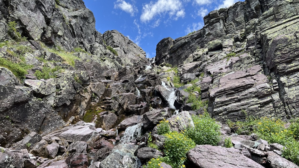 a waterfall in the middle of a rocky area