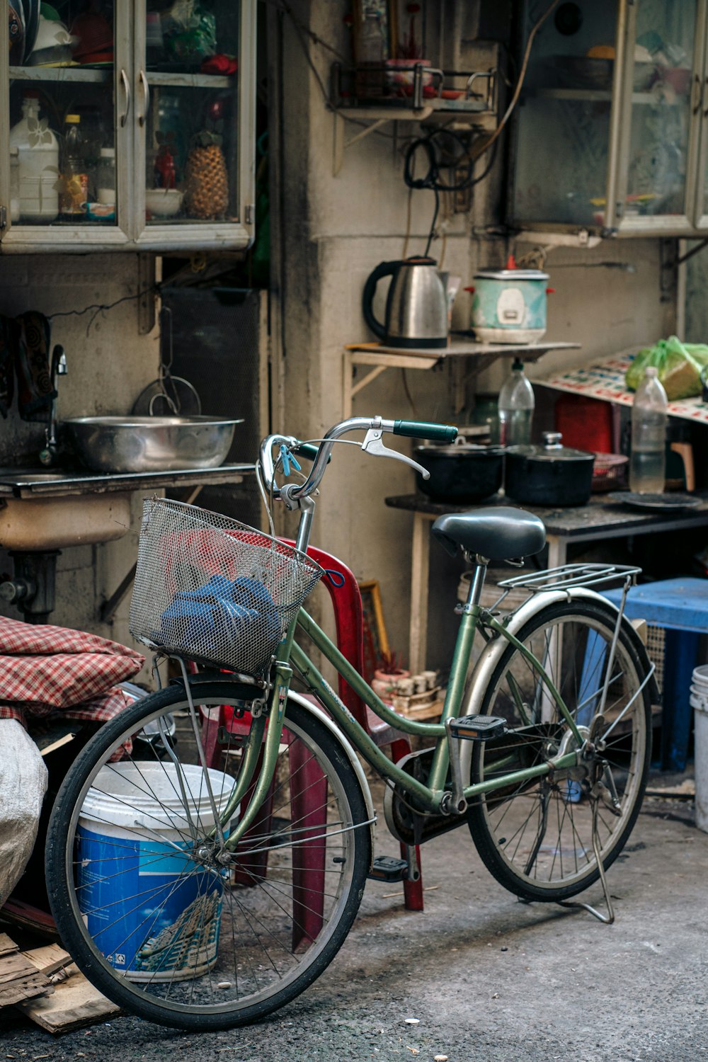 a bicycle parked in front of a kitchen
