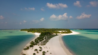 An aerial view of a stunning island surrounded by turquoise waters.
