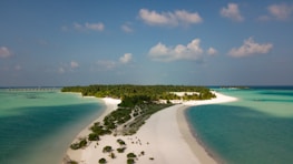 A breathtaking view of Menjangan Island from above, surrounded by turquoise waters.