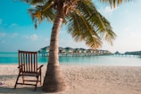 Private veranda of the Beach Bungalow overlooking the turquoise sea and sandy shore.