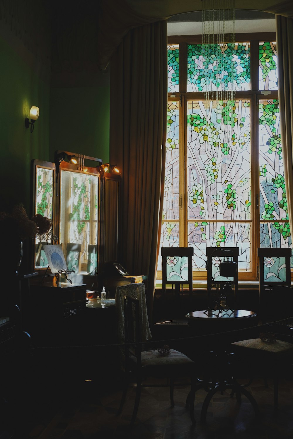 a living room with a large stained glass window