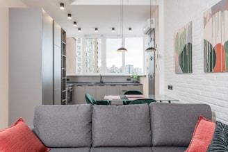 Before and after images showing a beautifully refurbished kitchen and living area.