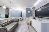 The suite room's living area with modern furniture.
