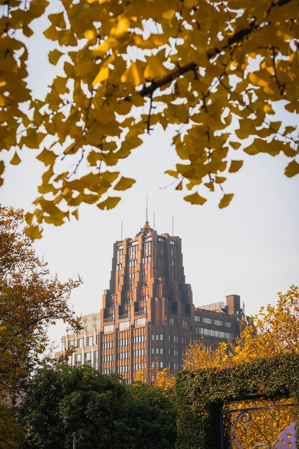 a tall building with a clock tower in the background