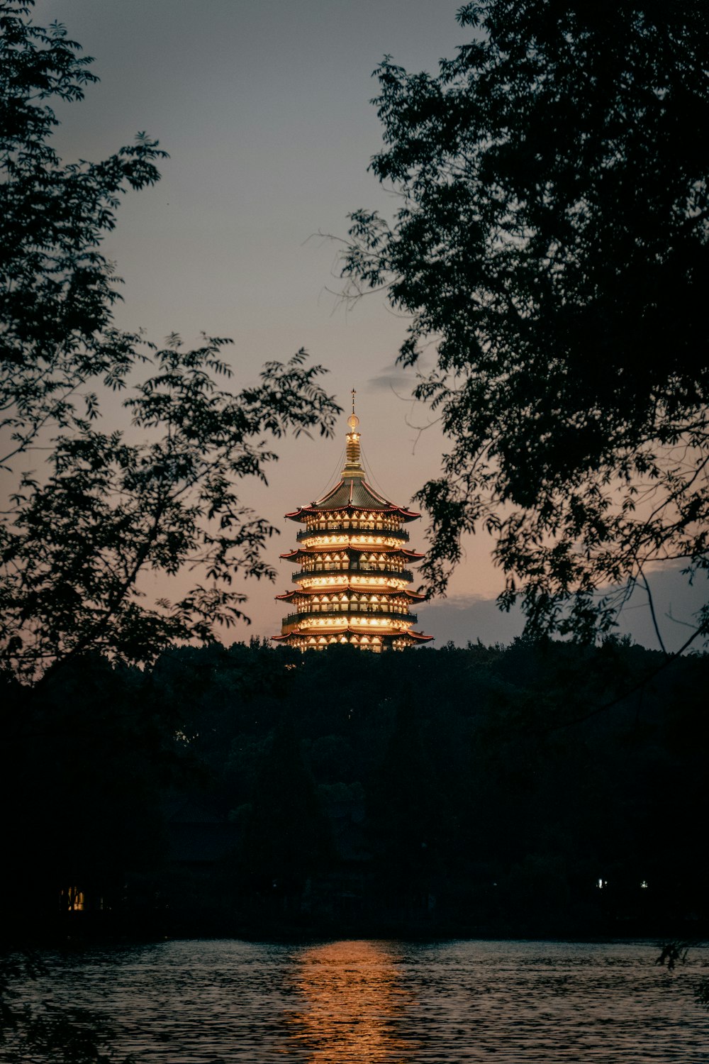 a tall tower sitting above a body of water