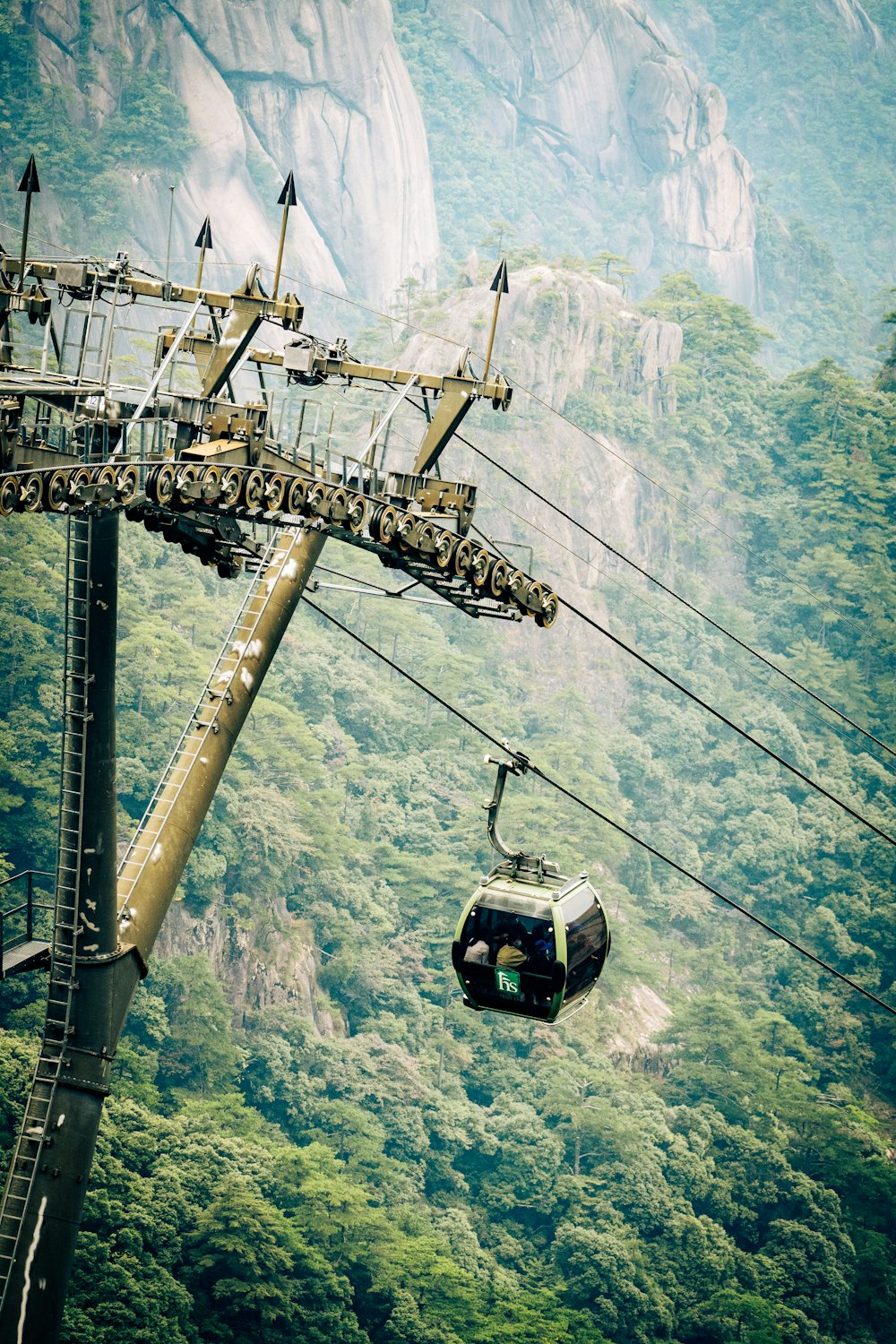 a cable car going up a mountain side