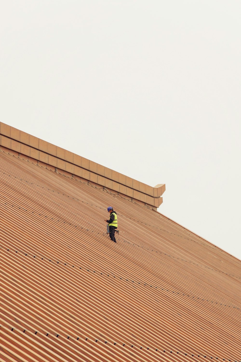 a person standing on top of a roof