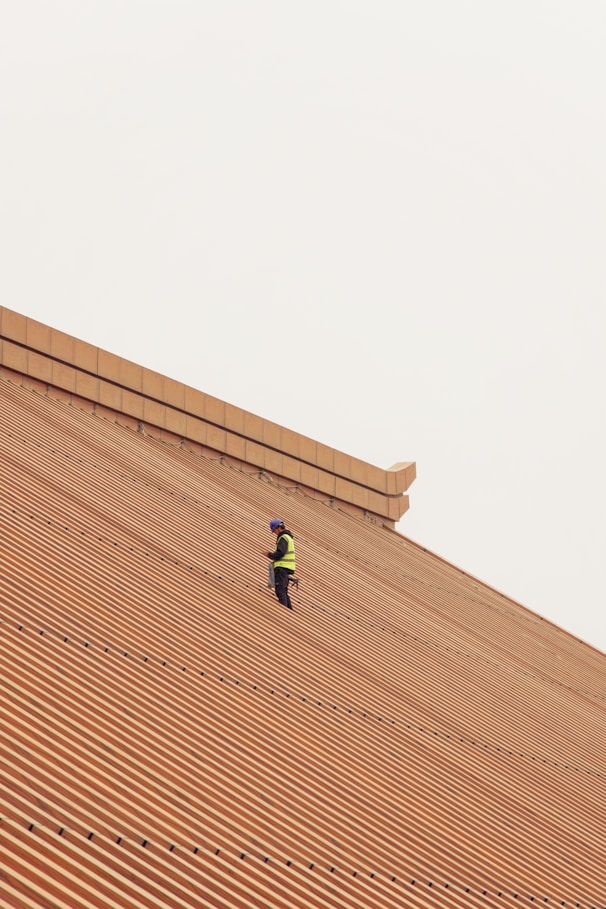a person standing on top of a roof