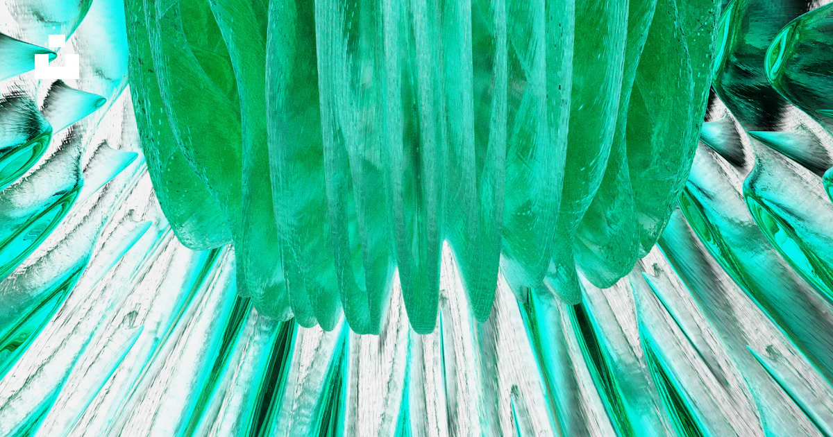 A close up of a green and silver object photo – Free Turquoise Image on ...