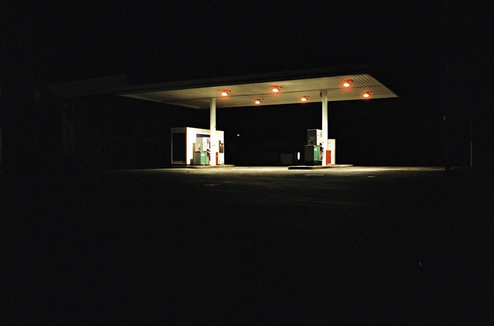 a gas station at night with no people