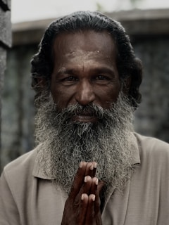 Gerry Sánchez Alban smiling warmly while engaging with attendees after a spiritual growth seminar.